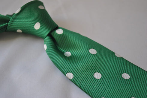 dark green tie with white polka dots